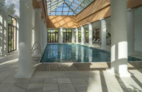 Aloha Park's indoor heated pool beneath a glazed roof
